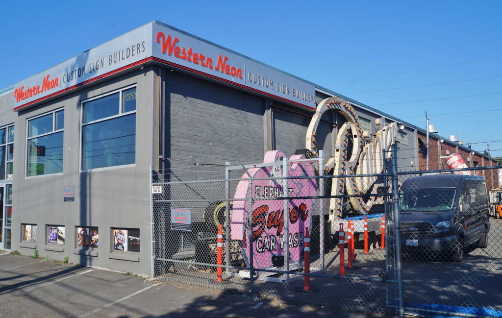 The smaller pink Elephant Car Wash sign in storage at Western Neon in Seattle in August 2022.